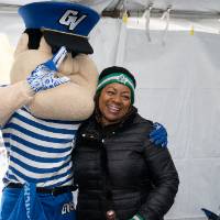 louie takes picture with woman